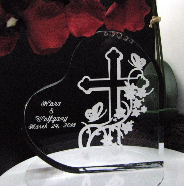 Custom engraved acrylic wedding cake topper designed with the couple for their special day.